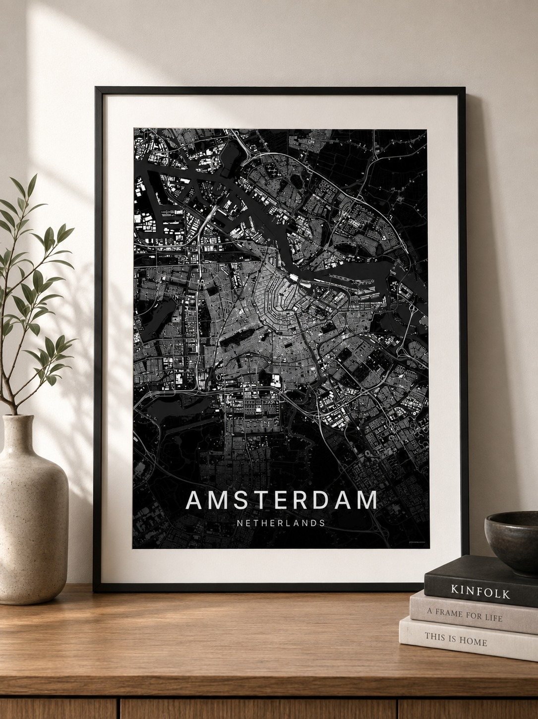 Amsterdam map print framed on a wall