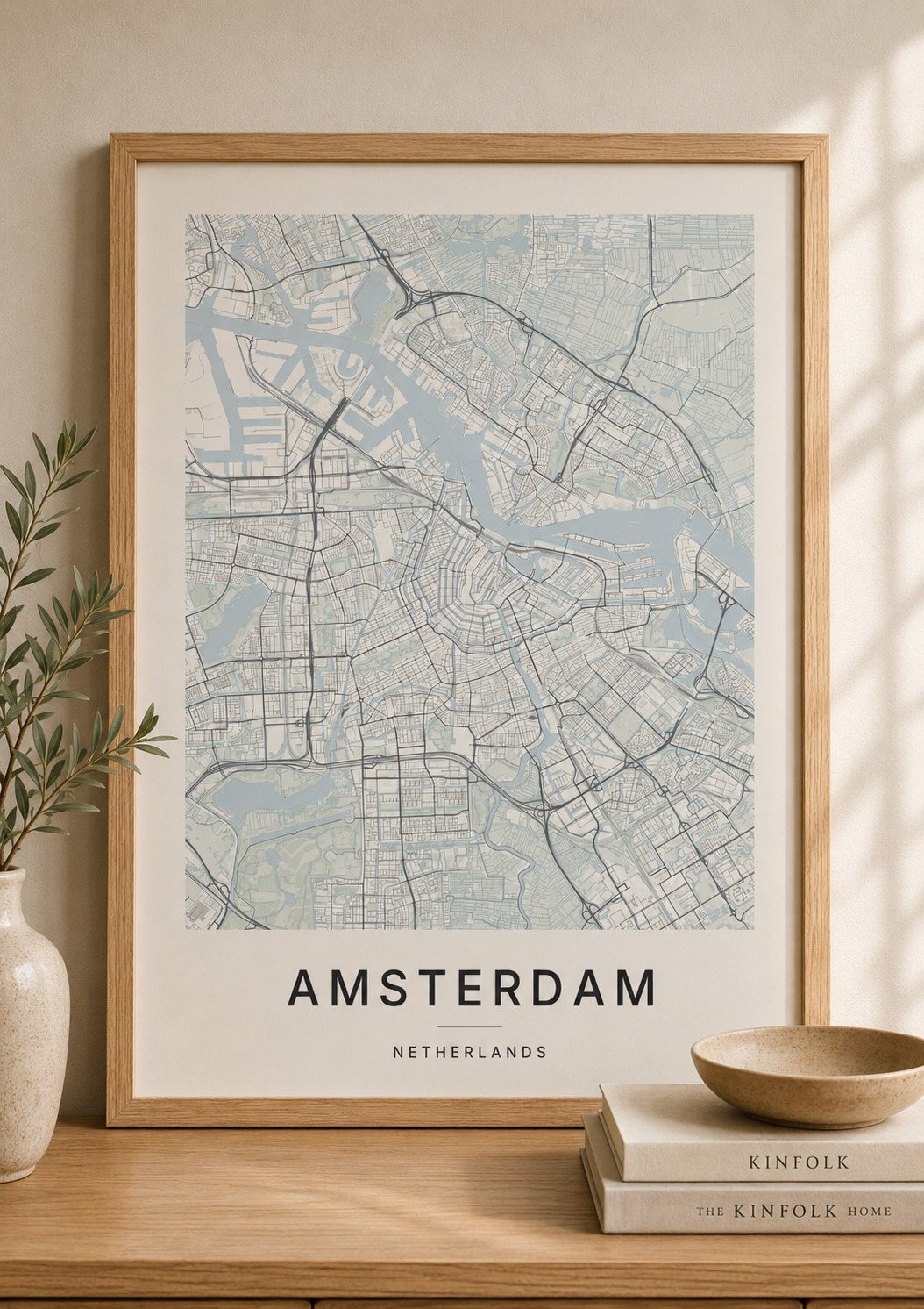 Amsterdam map print framed on a wall