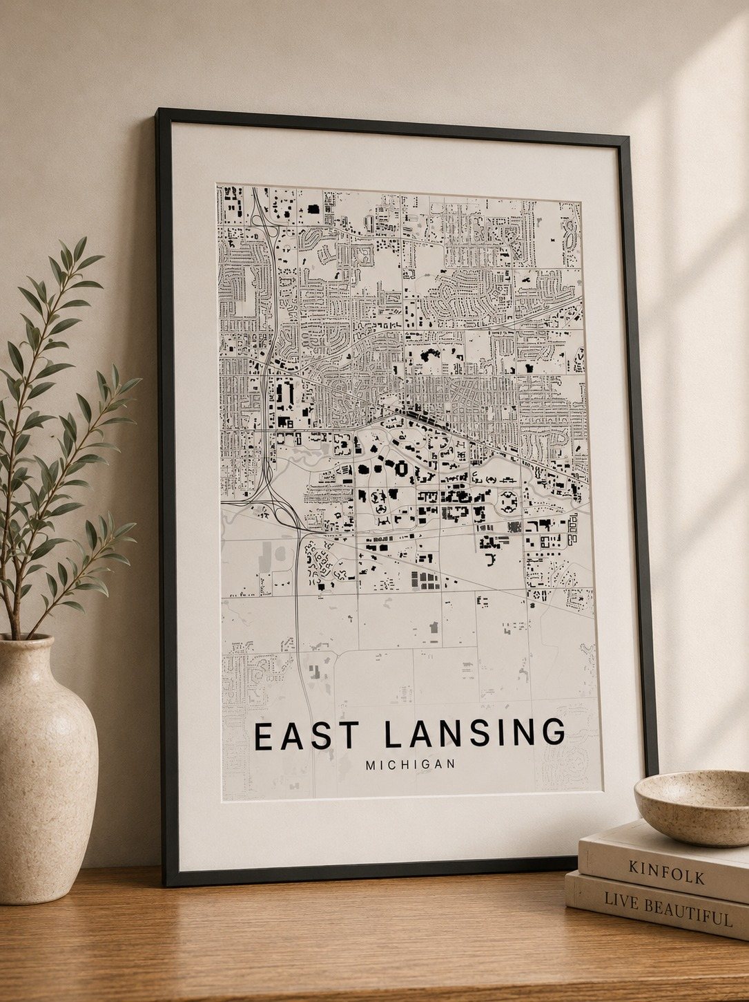 East Lansing map print framed on a wall