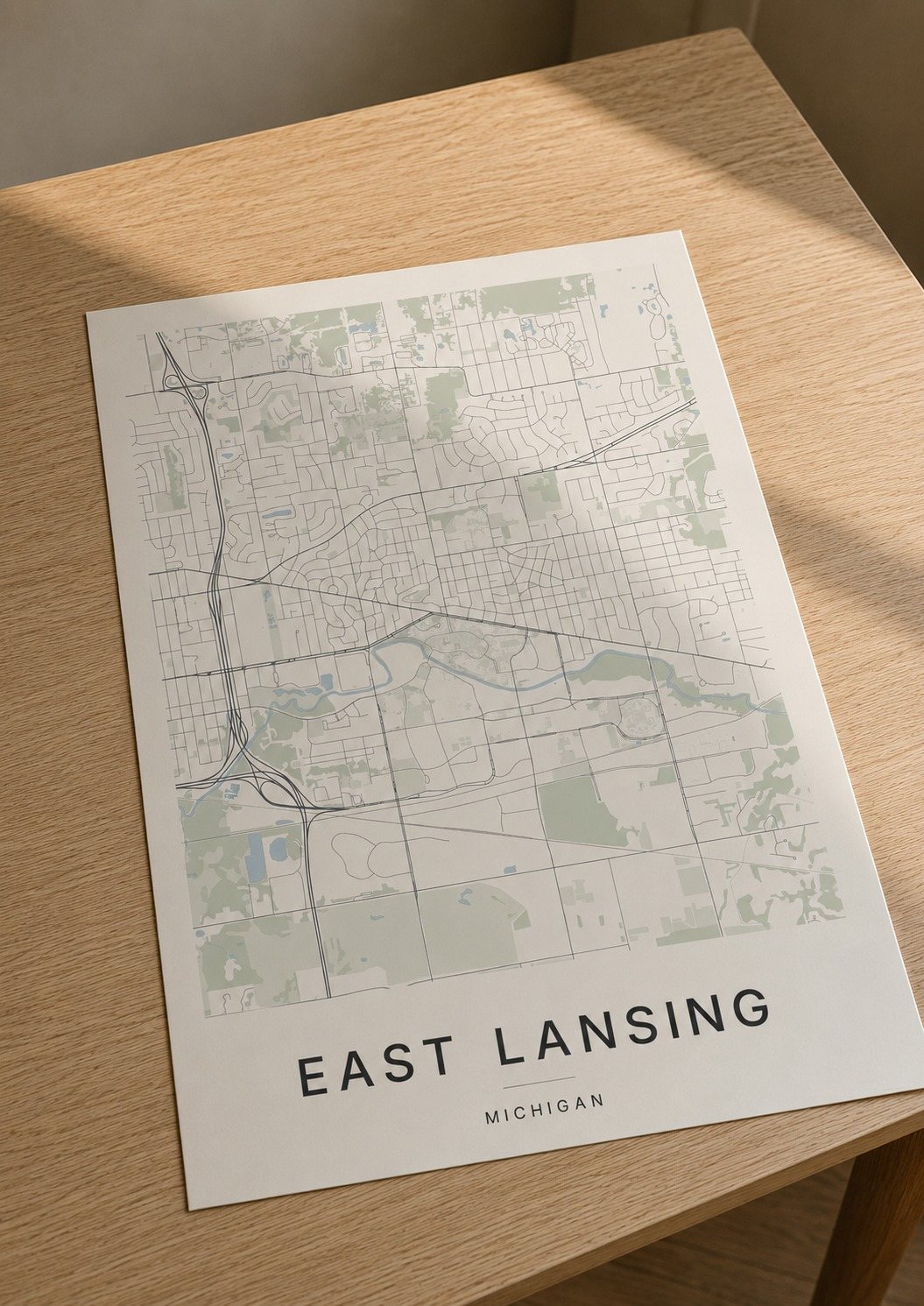 East Lansing map print framed on a wall