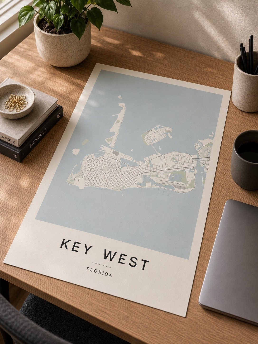 Key west map print framed on a wall