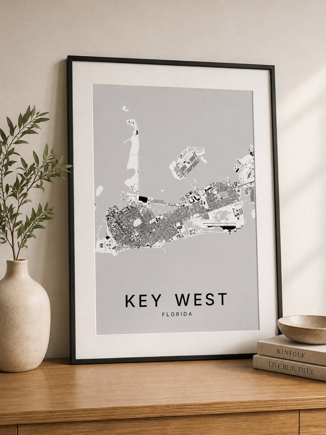 Key west map print framed on a wall