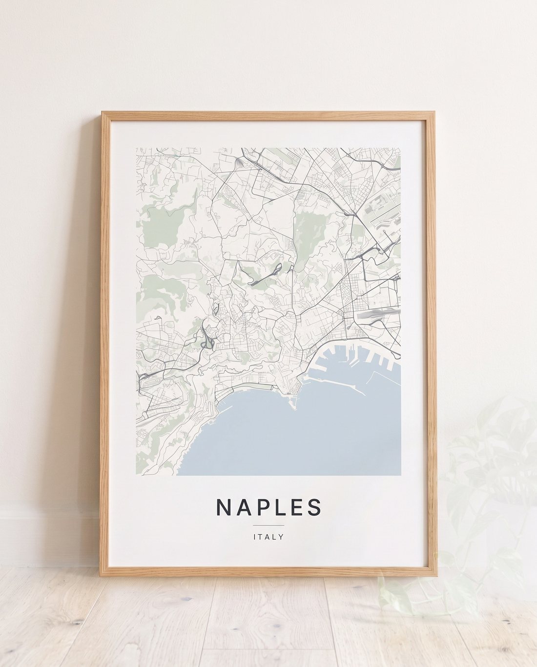 Naples map print framed on a wall