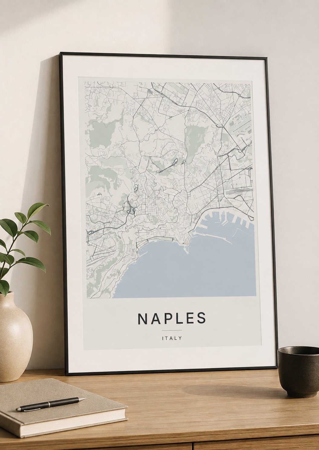 Naples map print framed on a wall